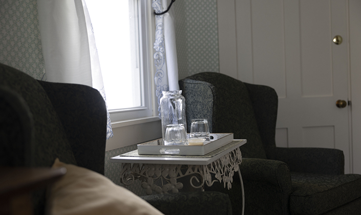 Bottle of wine and glasses in sitting room